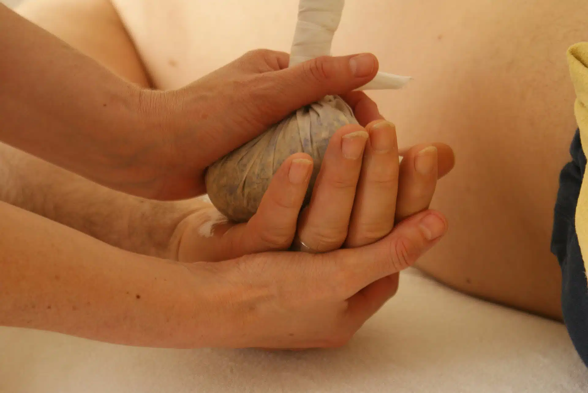 Herbal stamp massage - hand